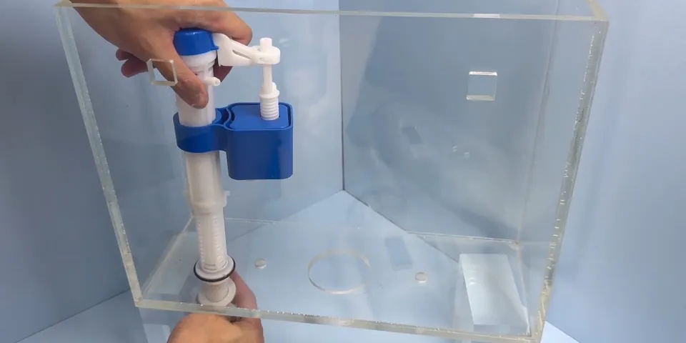 Hands replacing a toilet flapper and flush valve in the tank for Toilet Repair & Replacement in Lakewood, CA