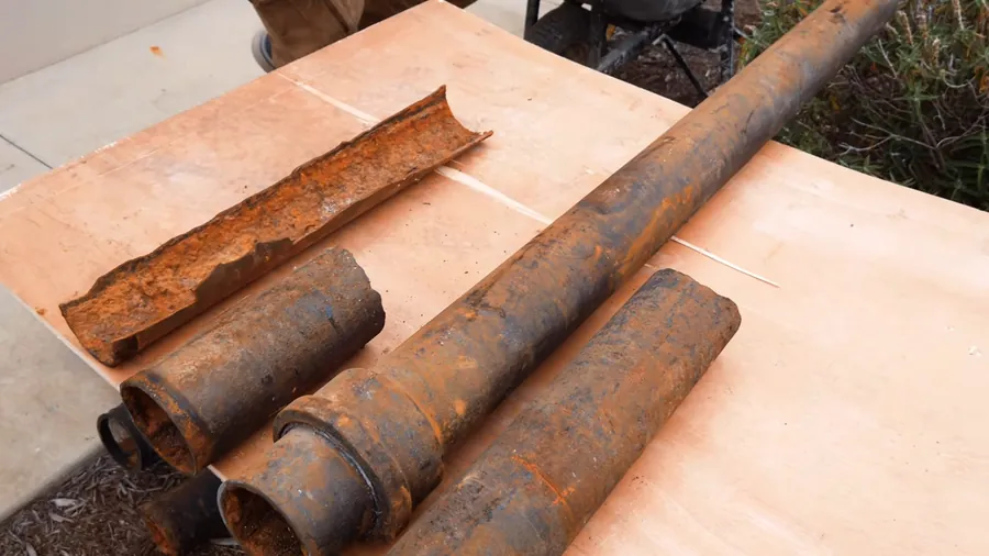 Old cast iron drain pipe with corrosion and scaling for Plumber in Compton, CA