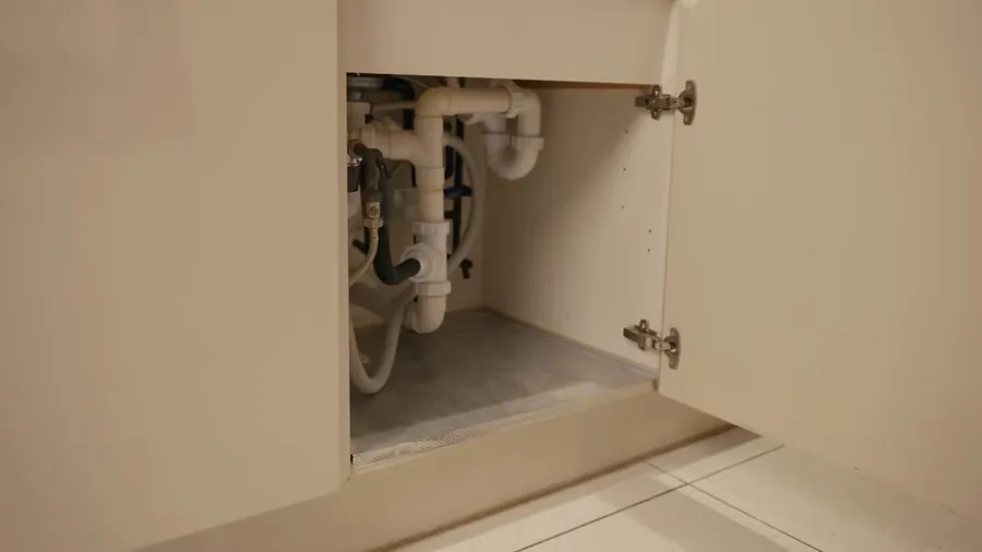 Sink faucet and under-cabinet plumbing connection for Plumbing Services in Lakewood, CA
