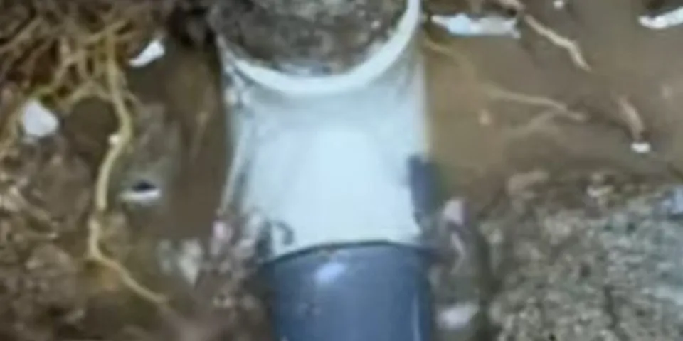 Slab leak pipe access exposed beside a foundation for Slab Leak Detection & Repair in Lakewood, CA