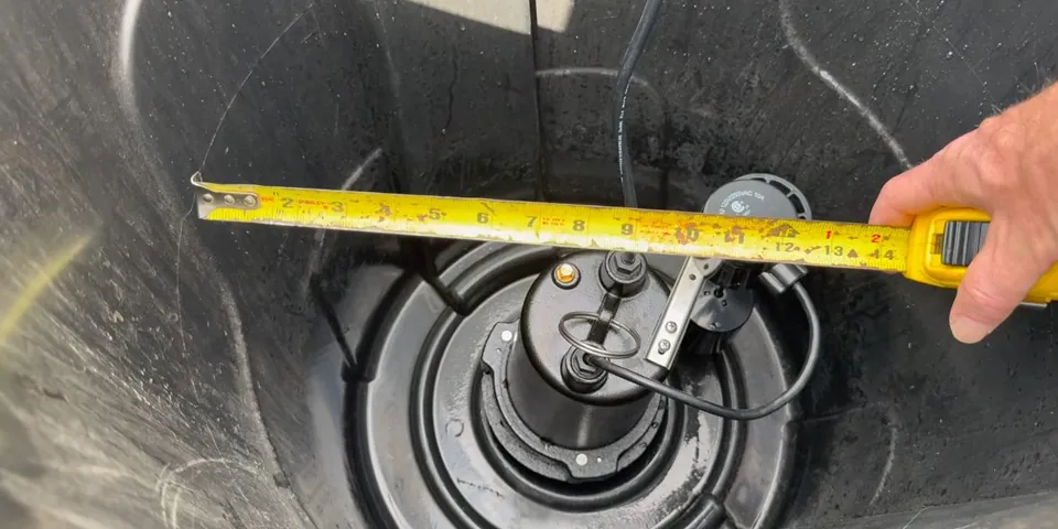 Sump basin opening being measured during pump work for Plumbing Service in Lakewood Plaza, Lakewood CA